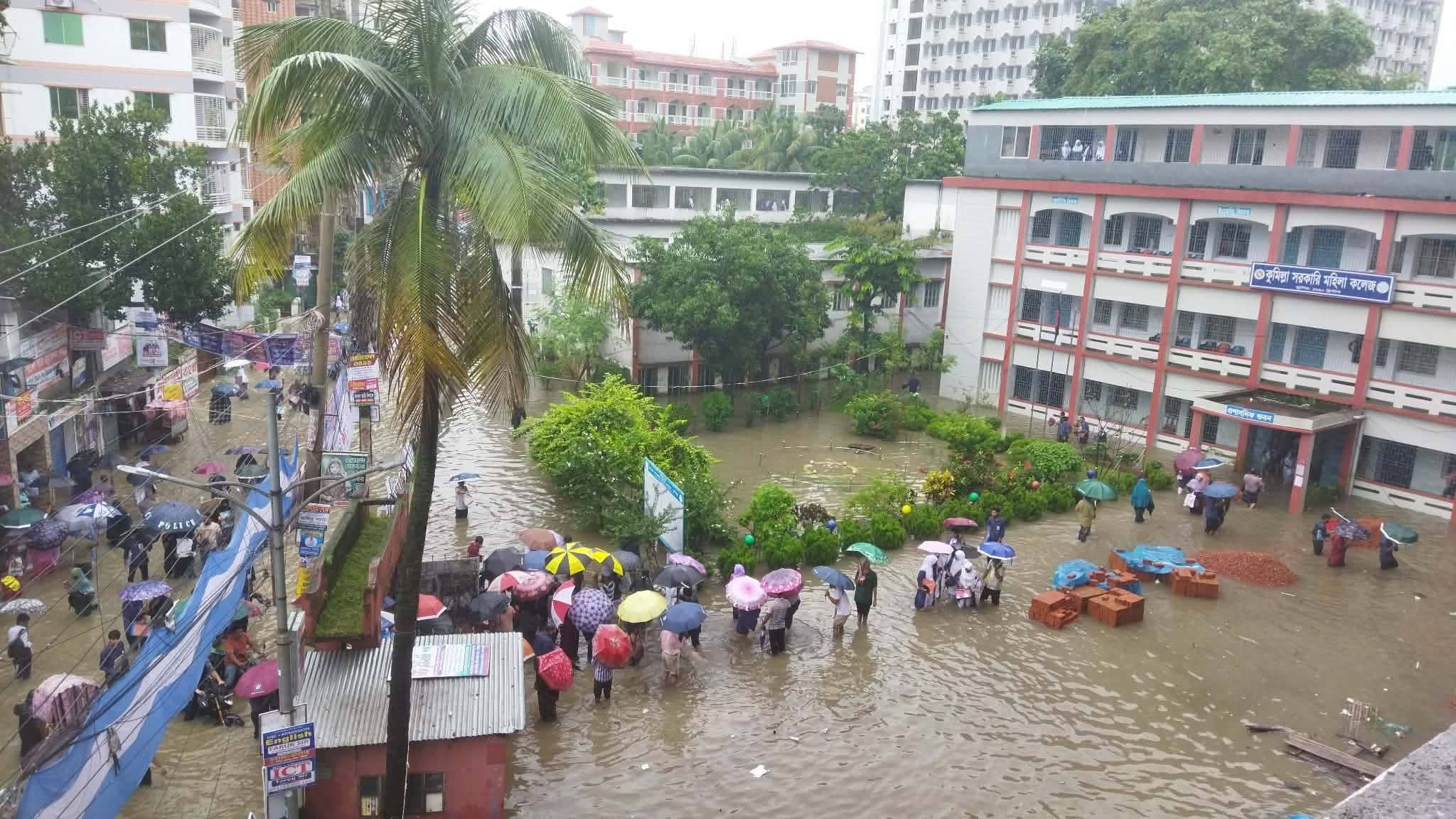 HSC examinees wade through floodwaters to reach centres