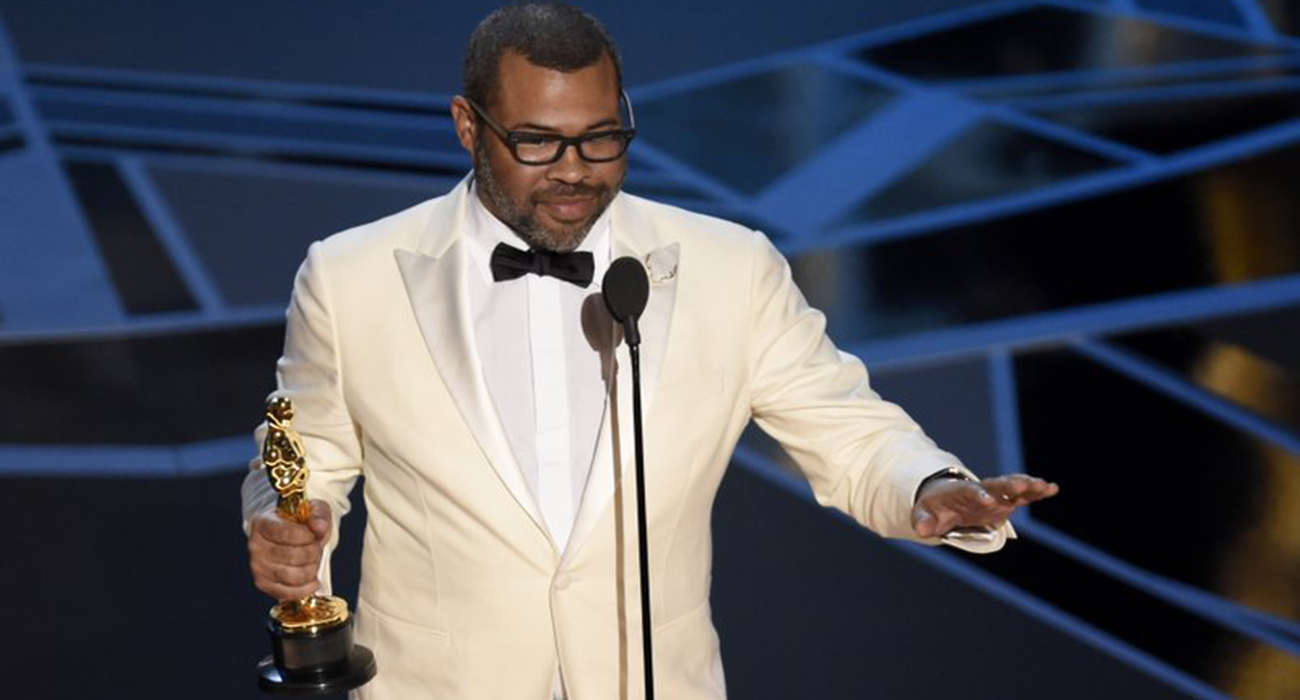 Peele, Del Toro win at an Oscars full of change
