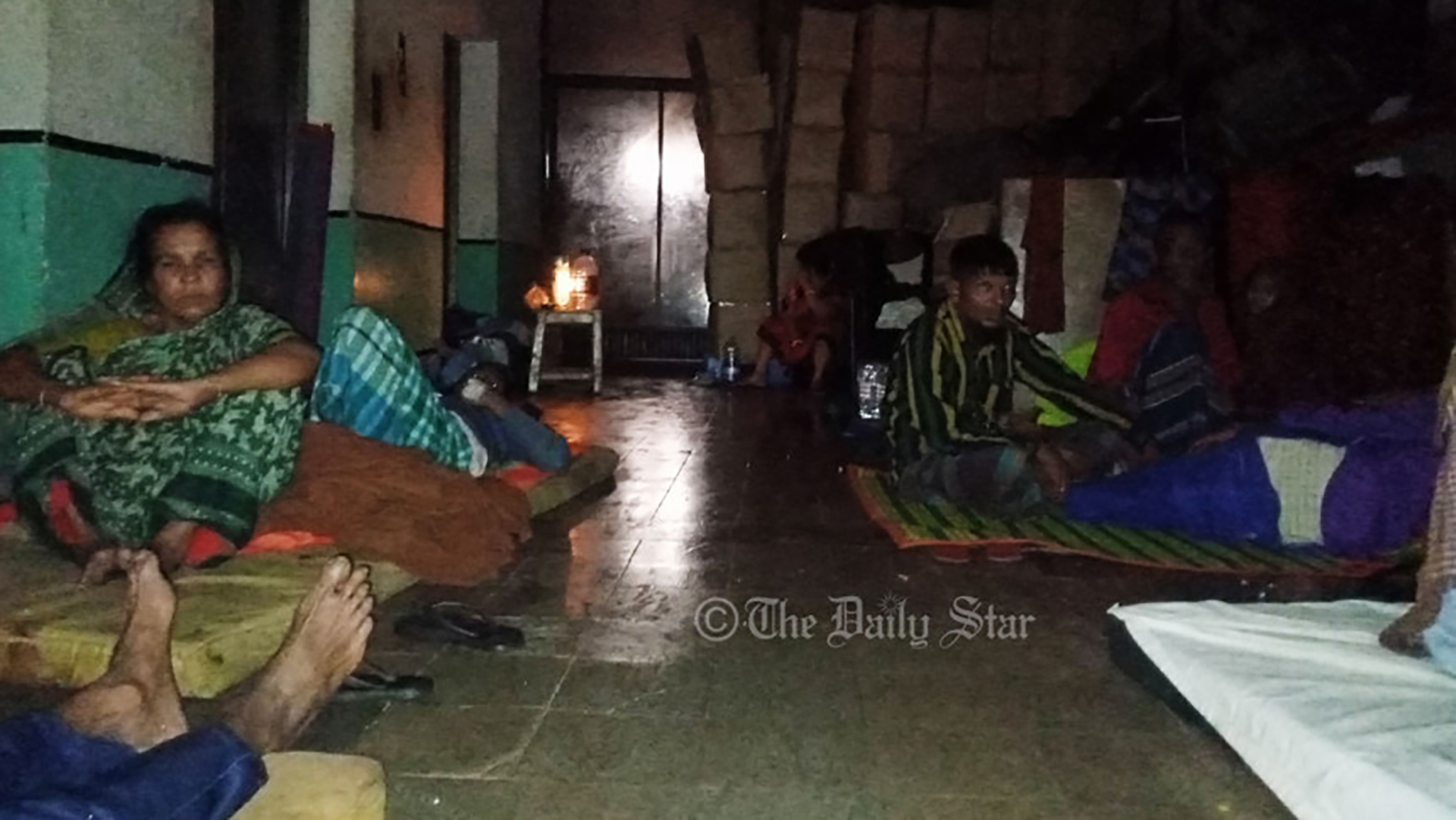 Treatment using candles at Osmani medical as floodwaters submerge ground floor, patients moved