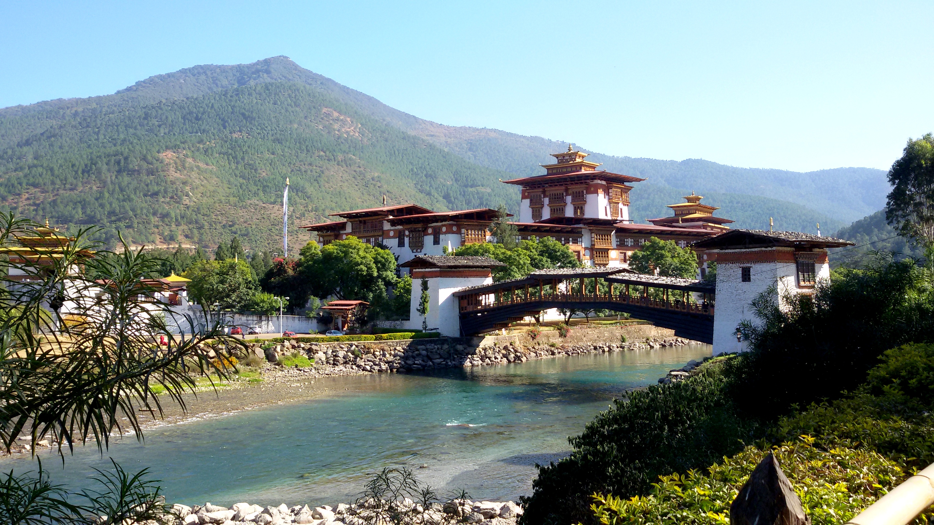 Bhutan cuts daily tourist fee by half