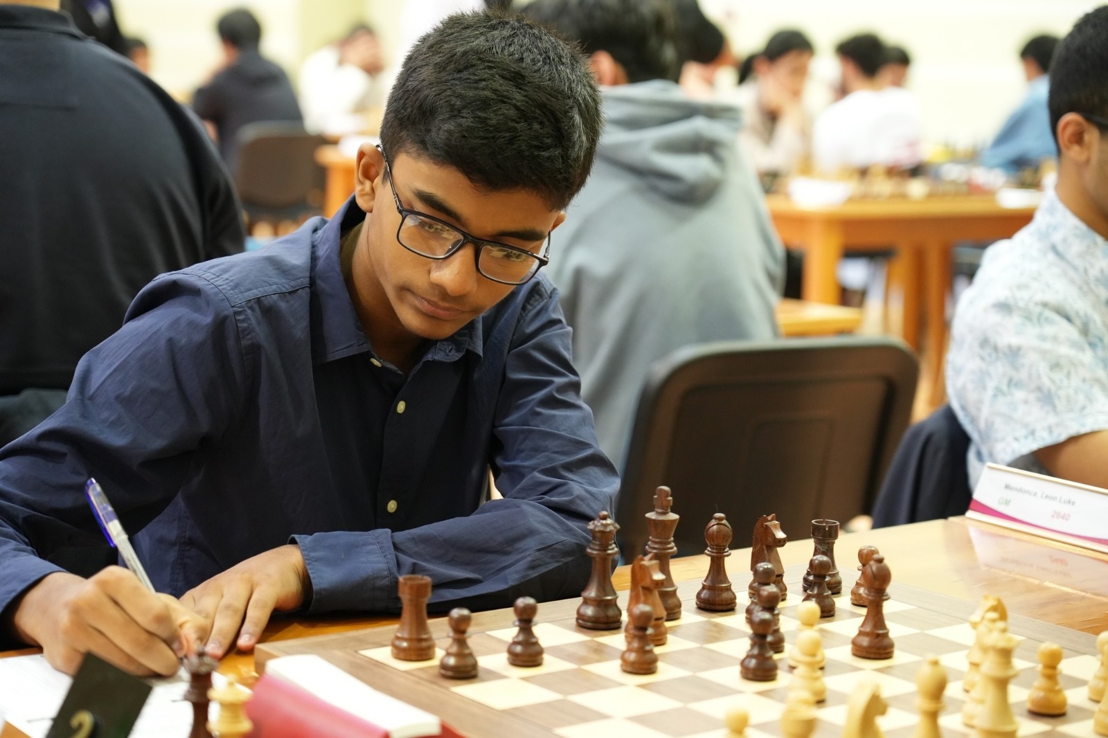 Neer wins chess championship with heavy heart