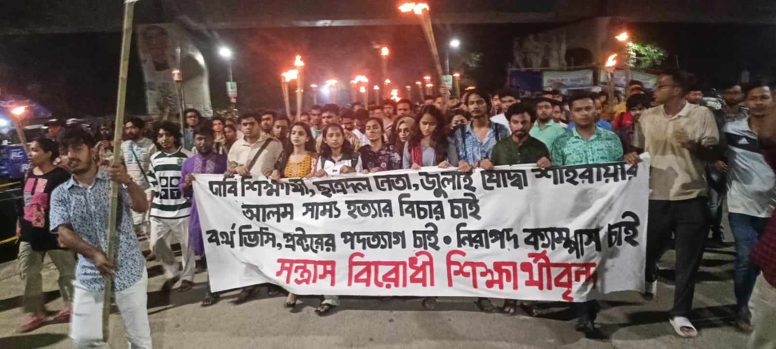 Torch procession at DU demanding justice for JCD leader Shammo