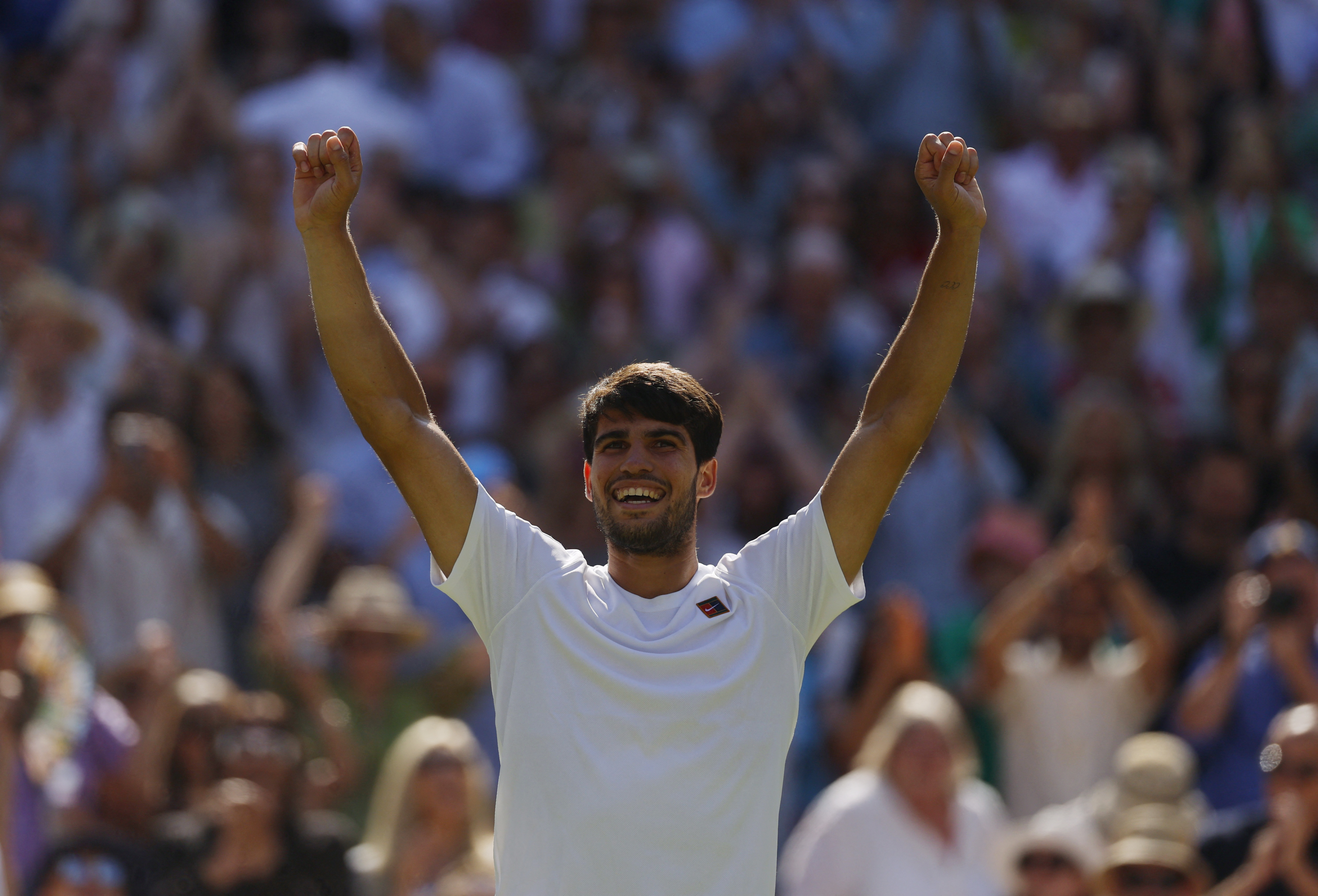 Alcaraz muscles past Fritz to reach third successive Wimbledon final
