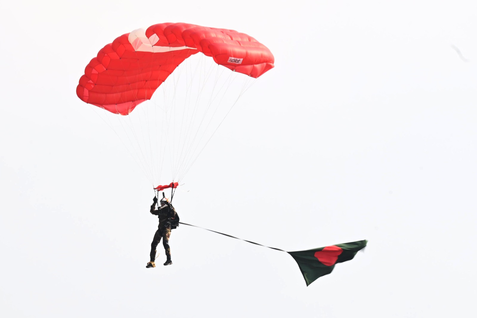 Chief adviser observes Victory Day fly past, parajump