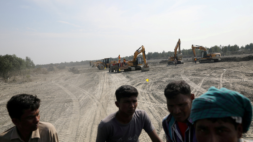Construction workers stack stones on the island of Bhasan Char in the Bay of Bengal, Bangladesh February 14, 2018. Photo: Reuters