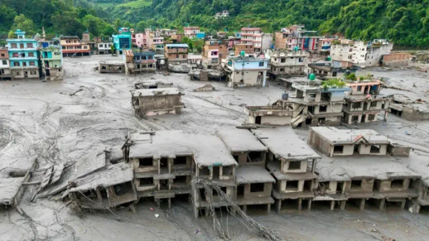 Rescuers are searching for survivors after the massive flash flood along the Nepal-Tibet border destroyed homes, roads and bridges, with rescue efforts hampered by continued rain and difficult terrain. Photo: AFP