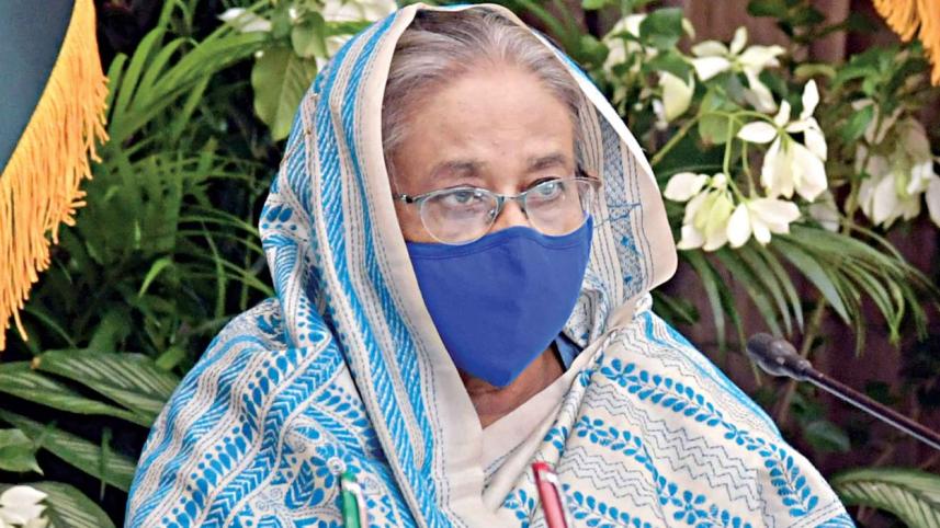 Sheikh Hasina masks.jpg
