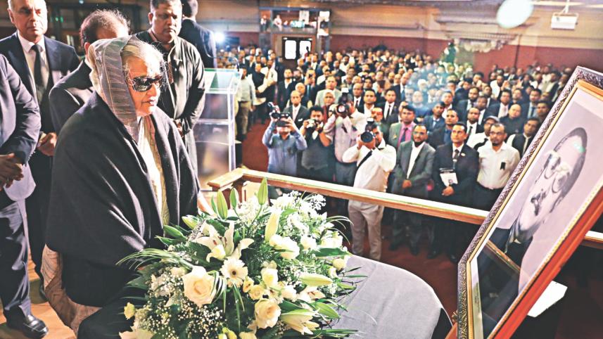 Hasina stands silence.jpg