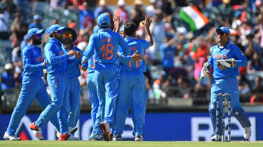 Indian fielders celebrate wicket