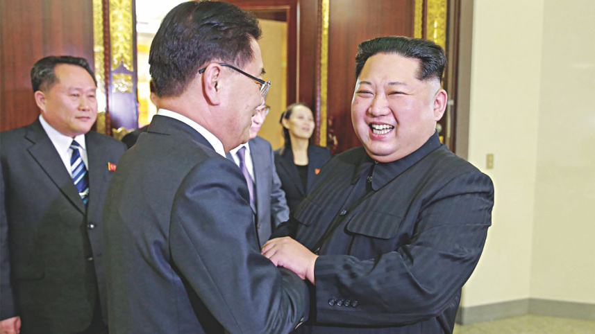 Kim Jong Un shakes Chung Eui-yong.jpg