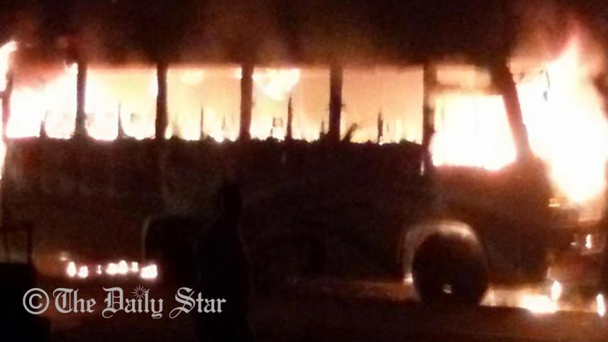 Two transport workers are burnt as miscreants torch a bus in Borolekha upazila of Moulvibazar Monday night. Photo: STAR