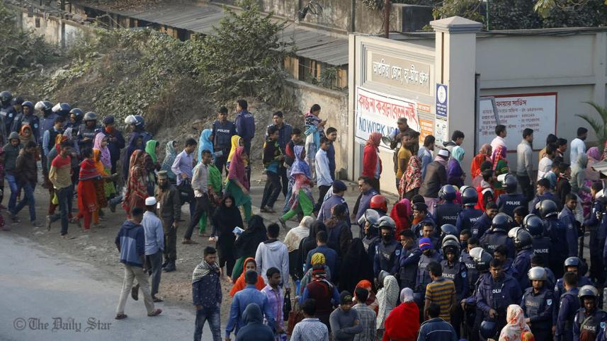 A large number of law enforcers are deployed in Ashulia as workers return to factories 