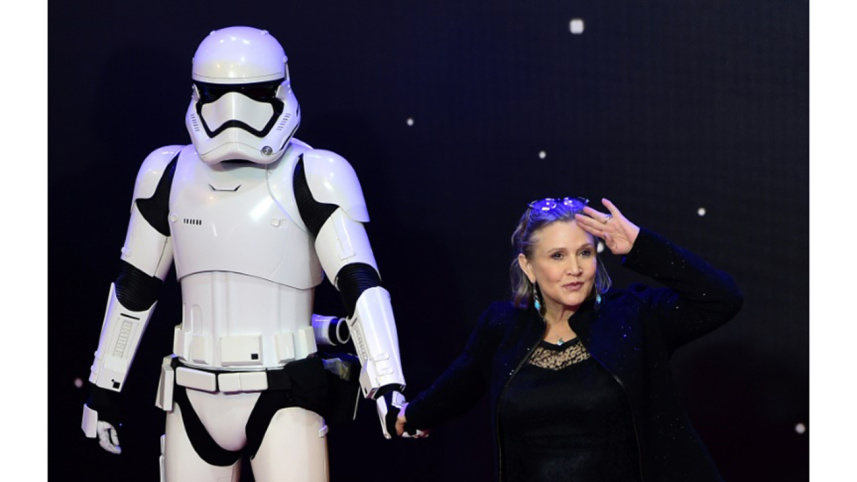 US actress Carrie Fisher poses with a Storm Trooper