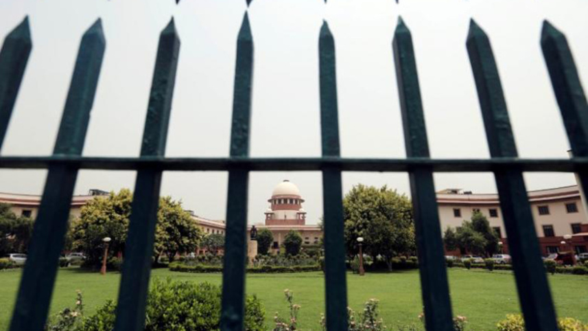 Supreme Court is pictured through a gate in New Delhi