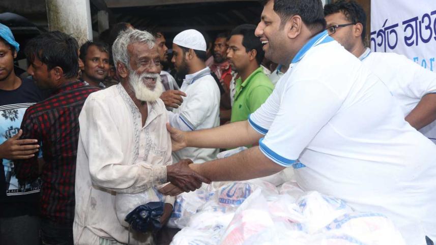 UHH distributes iftar and Eid gifts among haor people