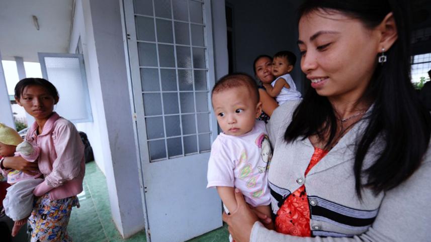 Vietnam mothers holding their babies