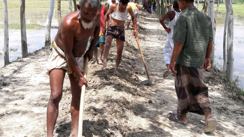 villagers repair road.jpg