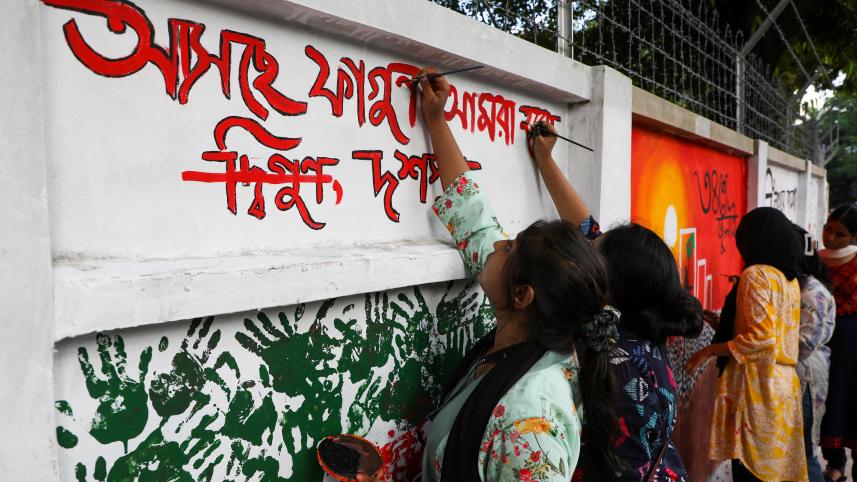 Students paint over vandalised walls