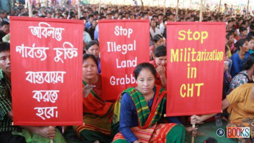indigenous people holding up placards about their rights in CHT