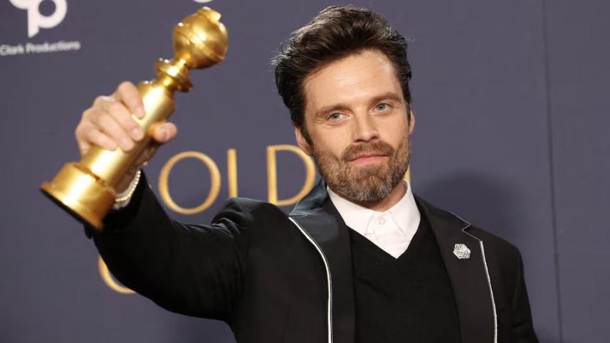 Sebastian Stan poses with the award for Best Performance by an Actor in a Motion Picture — Musical or Comedy for "A Different Man" at the 82nd Golden Globe Awards in Beverly Hills, California.jpg
