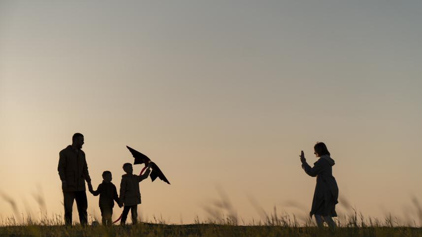 family-silhouettes-having-fun-sunset-full-shot.jpg