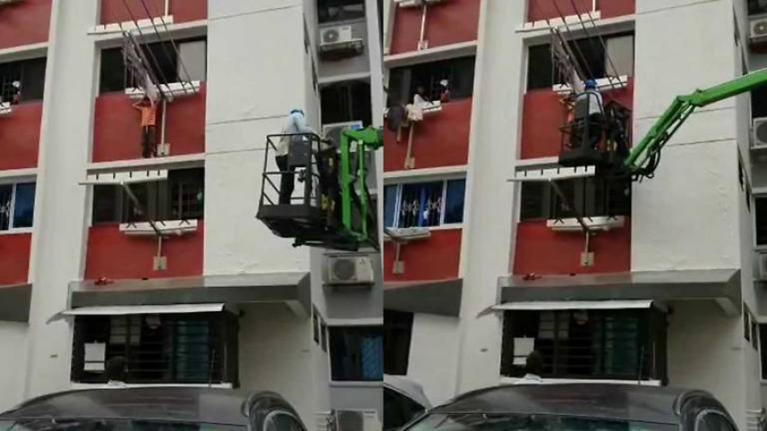 worker-in-boom-lift-rescues-child-on-window-ledge-of-hdb-flat-in-hougang.jpg