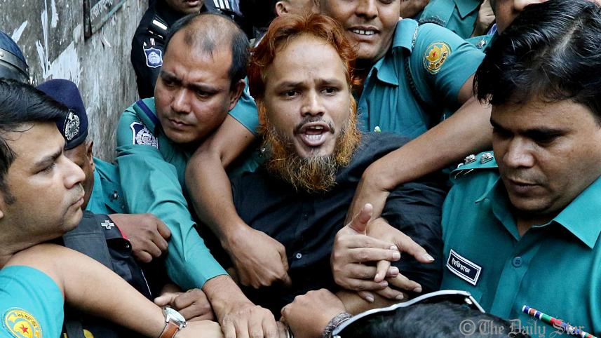 a_convict_in_the_holey_artisan_cafe_attack_case_is_being_taken_to_the_prison_van_amid_high_security._photo-anisur_rahman_star.jpg
