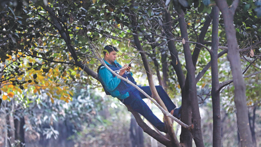 A police man relaxing while protest continuing...