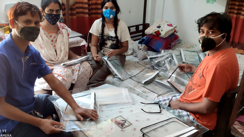 tutul_r_with_putul_effi_and_sangram_manufacture_face_shields_for_healthcare_professionals.jpg