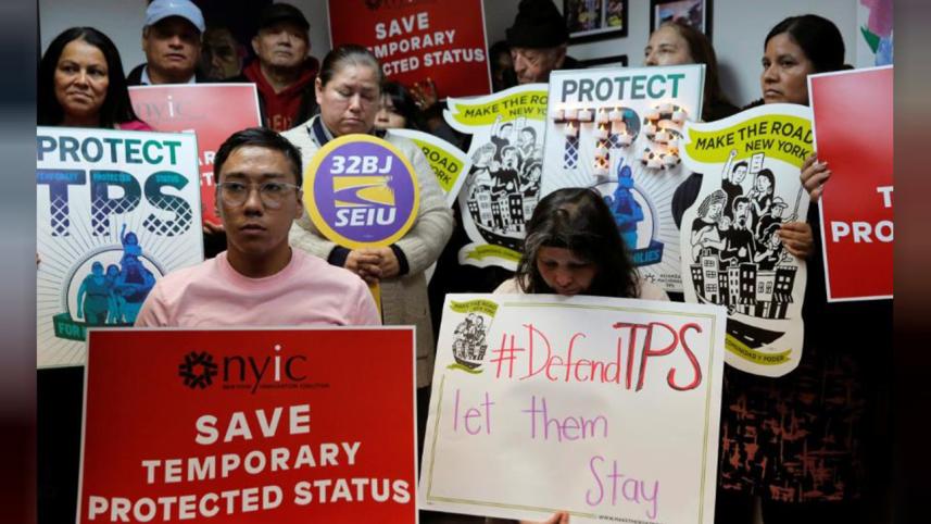 People gather during a news conferenc