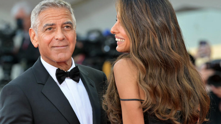 Actor George Clooney and his wife Amal Alamuddin on the red carpet at the Venice Film Festival 