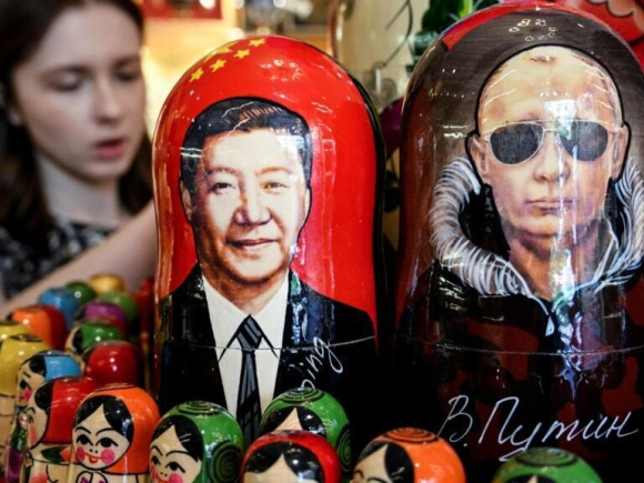 Russian President Vladimir Putin visits China's Xi Jinping days after Donald Trump's trip to Beijing. Photo: AFP