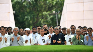 Prime Minister Tarique Rahman, alongside BNP leaders, offers homage at the grave of party founder Ziaur Rahman.