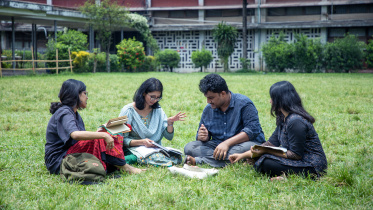 Four friends discussing things on campus