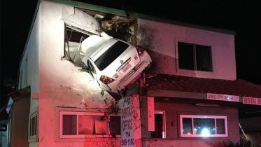 Car flies 20m into upper floor of building