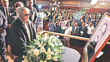 Hasina stands silence.jpg