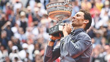 Rafael Nadal holds French Open trophy.jpg