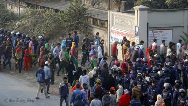 A large number of law enforcers are deployed in Ashulia as workers return to factories 