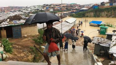 Rohingya refugees walks along the refugee camp