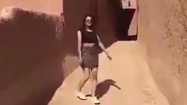 Saudi woman in minskirt, 