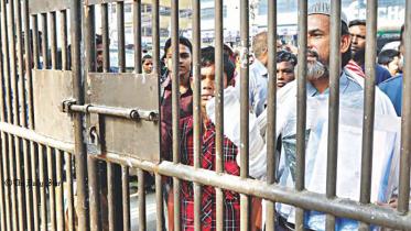 People wait outside the main gate of CMCH