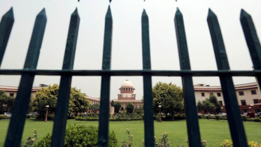 Supreme Court is pictured through a gate in New Delhi