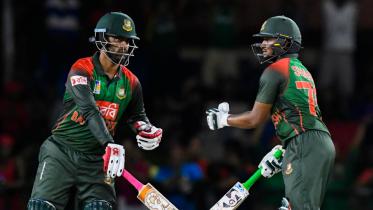 Tamim Iqbal and Shakib Al Hasan of Bangladesh speak during the 2nd T20i match 