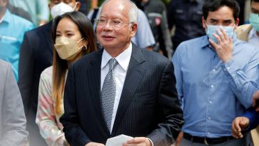 former_malaysia_prime_minister_najib_razak_walks_out_of_federal_court_-_reuters.jpg