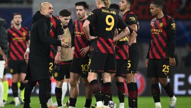 Pep Guardiola and Erling Haaland