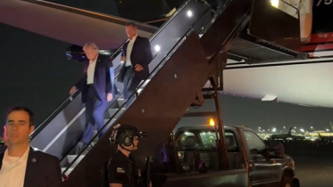 Trump seen walking off his plane after shooting