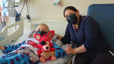 childhood-cancer-patient-in-hospital-bed.jpg