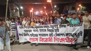 Torch rally at DU demanding justice for Shammo