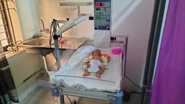 Infant abandoned at Dinajpur Medical College Hospital with note left behind.jpg