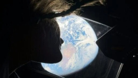 This handout picture by an Artemis II crew member provided by NASA shows Artemis II mission specialist Christina Koch looking back at earth through the window of the Orion spacecraft on April 2, 2026. Photo: AFP